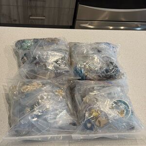 4 bags of Assorted Jewelry Lot in Clear Bags